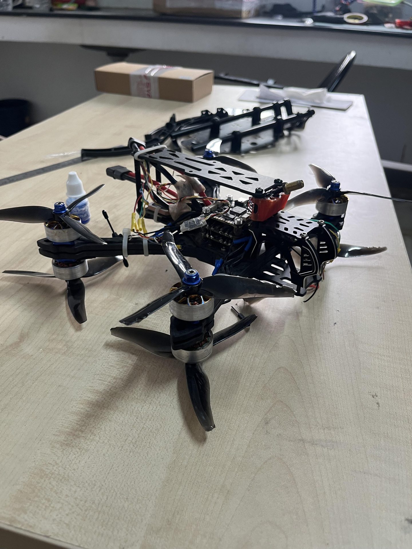 Racing quad build on workshop desk